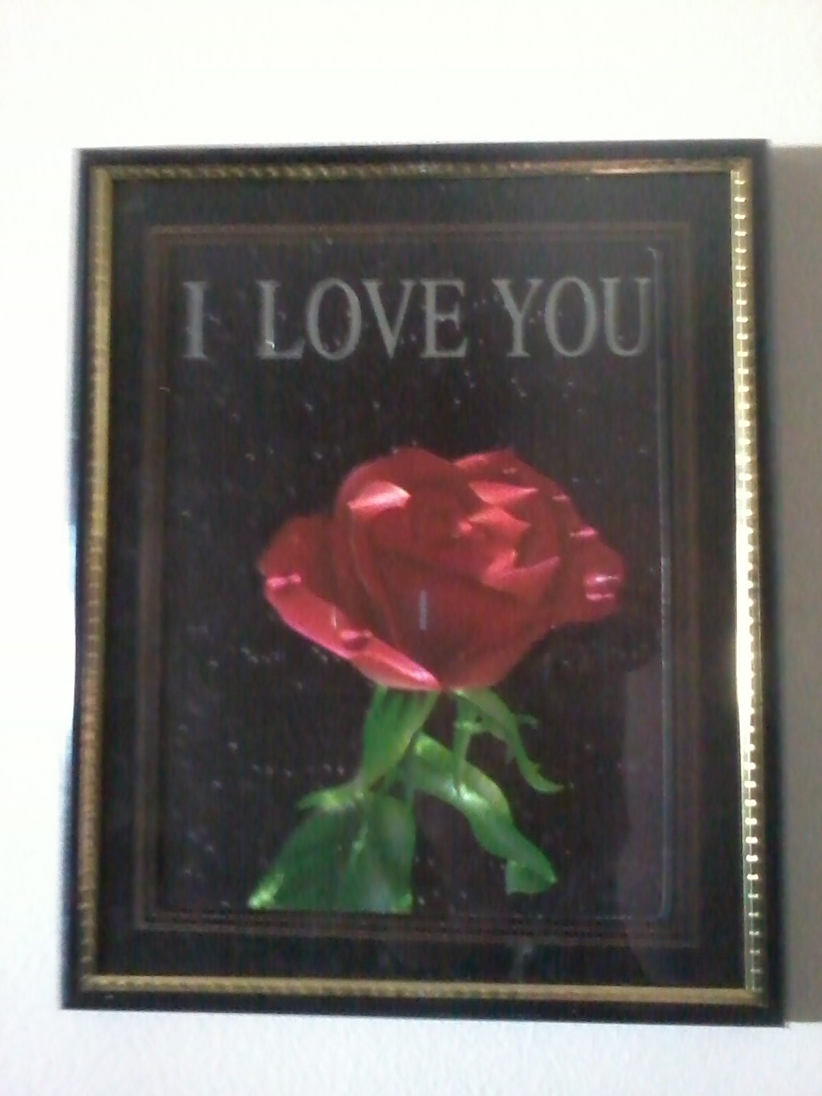 a picture of a rose accompanied by the words "I LOVE YOU"